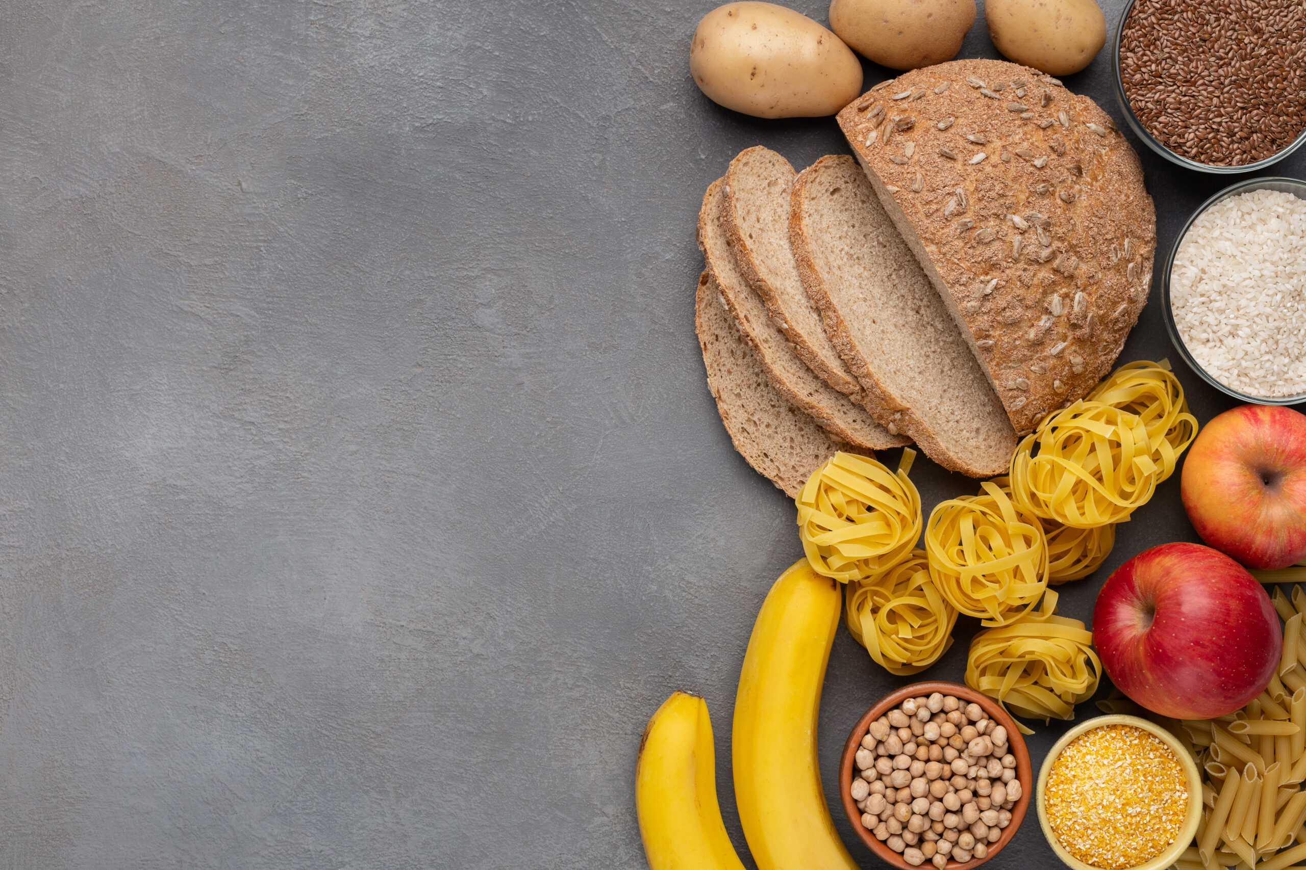 Food high in healthy carbohydrates on concrete background